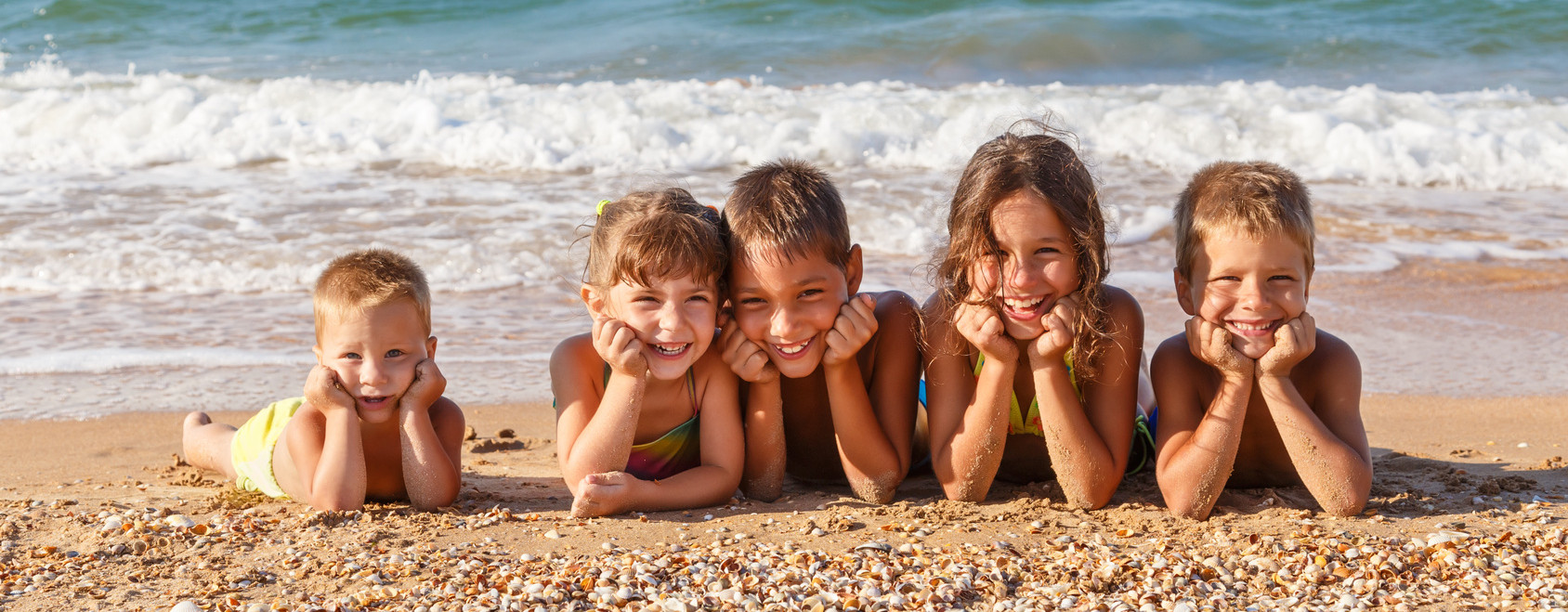 Five kids on the beach.